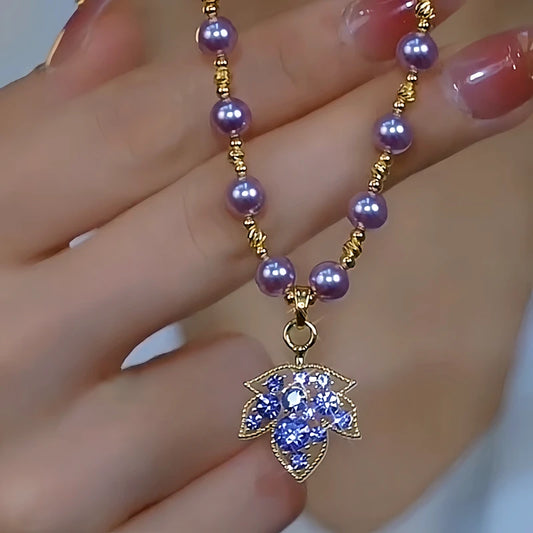 14K Gold-Plated Purple Diamond Maple Leaf Pearl Necklace worn to showcase its length and pendant detail