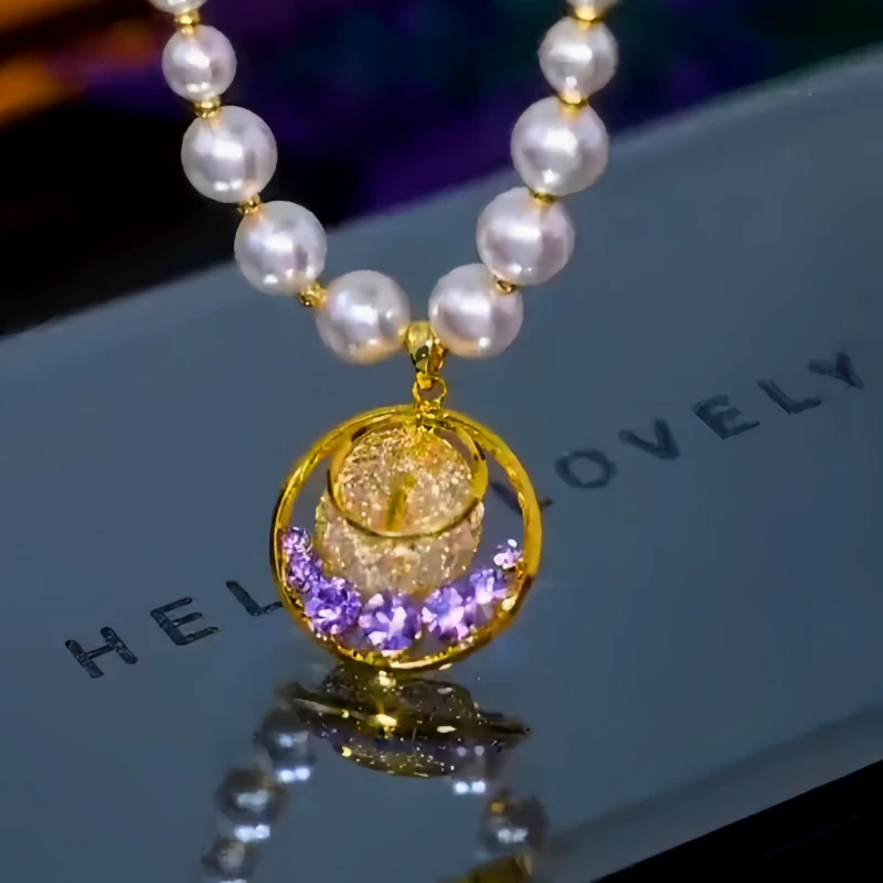 Close-up of the pendant and clasp on the Mesh Hoop Necklace