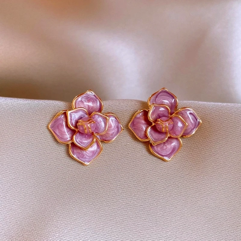 Angled view of the 14K Gold-Plated Purple Oil-Drop Flower Stud Earrings