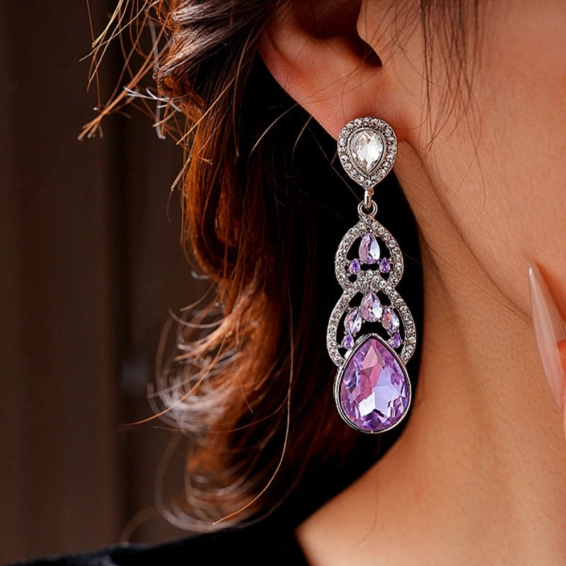 Angled view of the 14K Gold-Plated Purple Zircon Water Drop Earrings