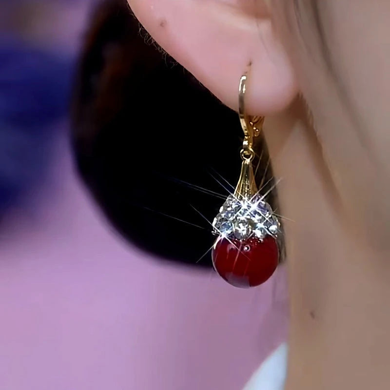 Close-up detail of the sparkling zircons and plating on the Red Bead Earrings