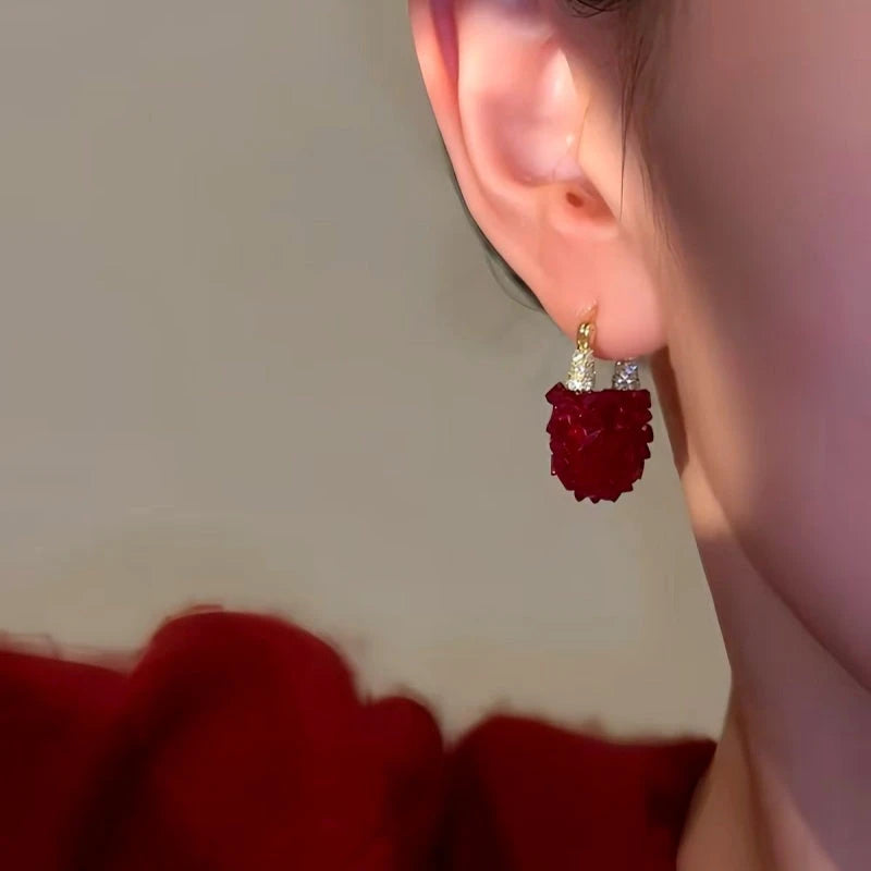 Close-up detail of the sparkling zircons and plating on the Red Crystal Earrings
