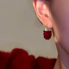 Close-up detail of the sparkling zircons and plating on the Red Crystal Earrings