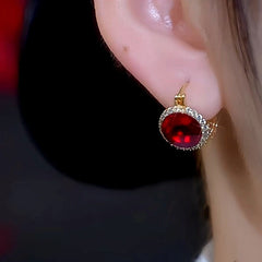 Close-up detail of the sparkling zircons and plating on the Red Crystal Earrings