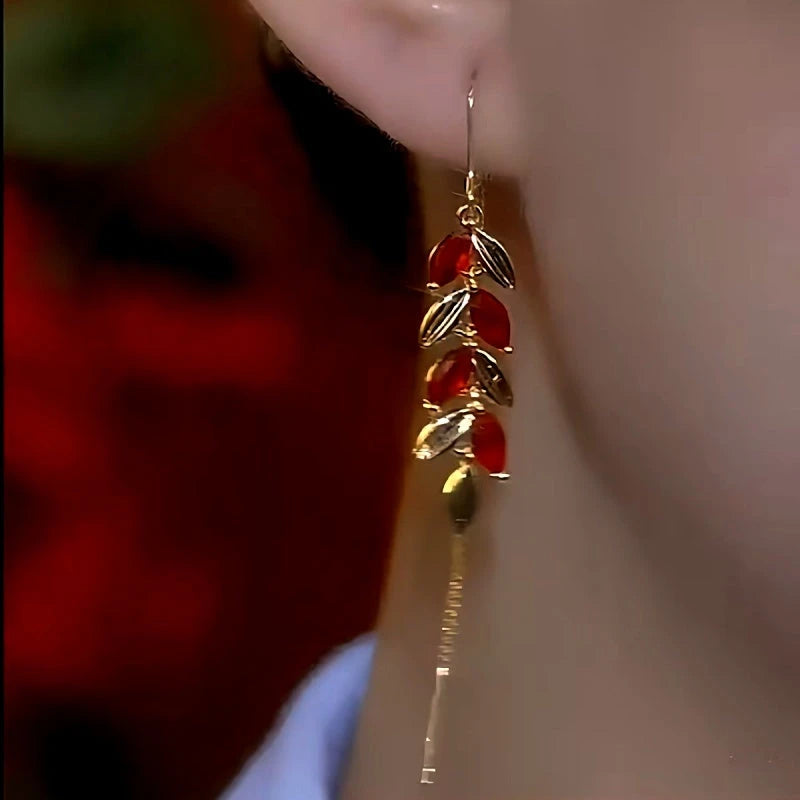 Matching Red Leaf Gold Tassel Drop Earring Worn On Ear Close-up