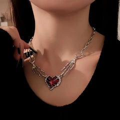 14K Gold-Plated Red Diamond Heart Ghost Claw Skeleton Hand Stitching Necklace worn to showcase its length and pendant detail