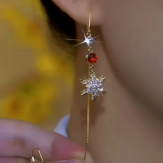 Model showcasing the dangle and style of the 14K Gold-Plated Diamond Snowflake Threader Earrings