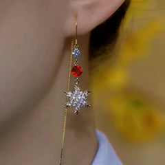 Close-up detail of the sparkling zircons and plating on the Snowflake Threader Earrings