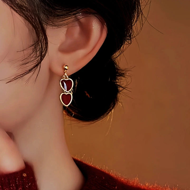 Close-up detail of the sparkling zircons and plating on the Red Heart Earrings