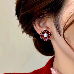 Close-up detail of the sparkling zircons and plating on the Flower Pearl Studs