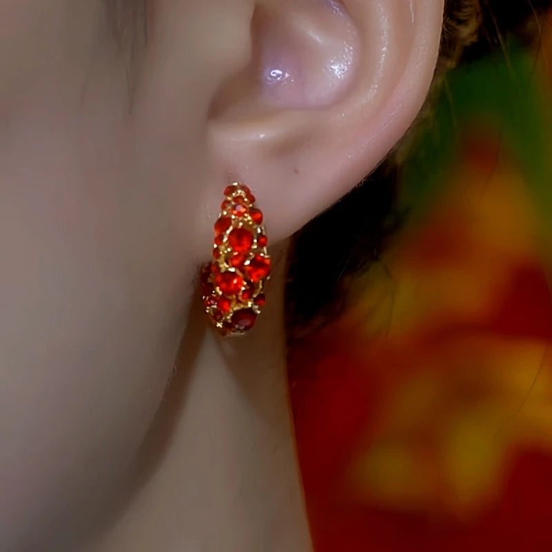 Close-up detail of the sparkling zircons and plating on the Red Zircon Hoops