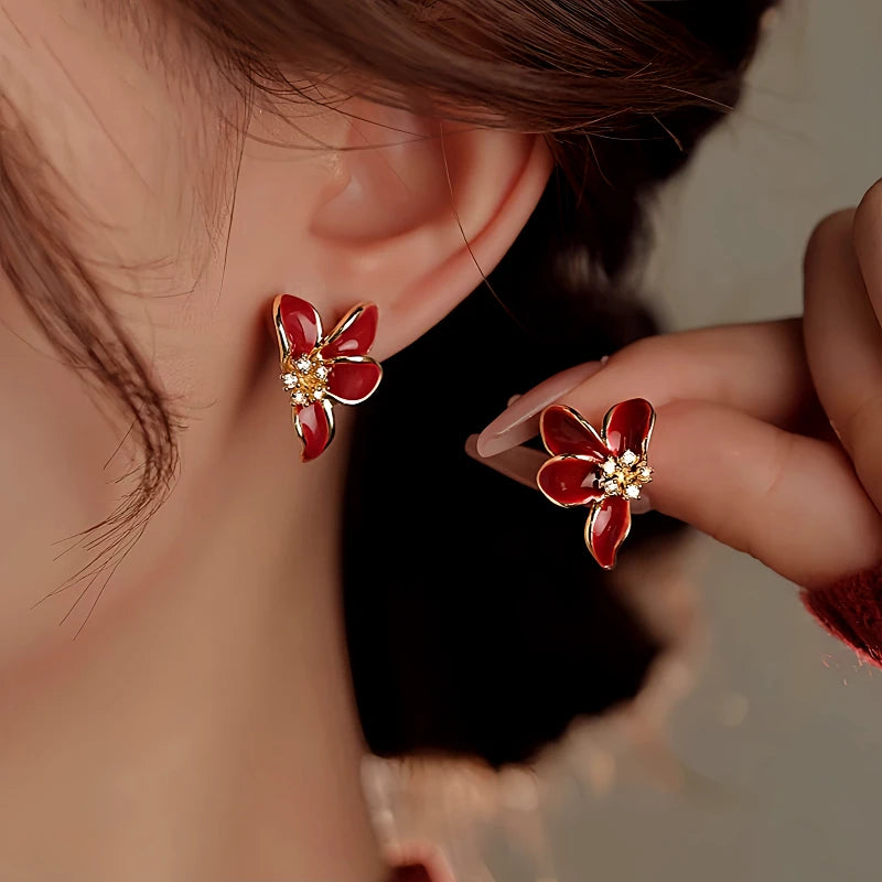 Close-up detail of the sparkling zircons and plating on the Red Glaze Flower Earrings