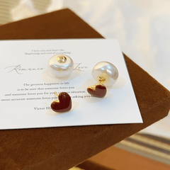 Angled view of the 14K Gold-Plated Red Heart Bead Earrings