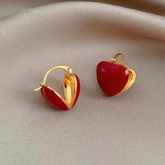 Angled view of the 14K Gold-Plated Red Heart Earrings
