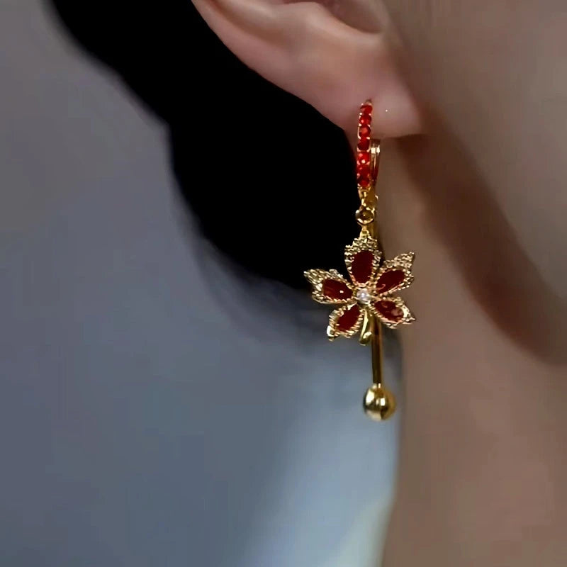 Close-up detail of the sparkling zircons and plating on the Maple Leaf Earrings