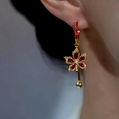 Close-up detail of the sparkling zircons and plating on the Maple Leaf Earrings