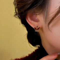 Close-up detail of the sparkling zircons and plating on the Butterfly Hoop Earrings