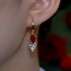 Close-up detail of the sparkling zircons and plating on the Double Leaf Earrings