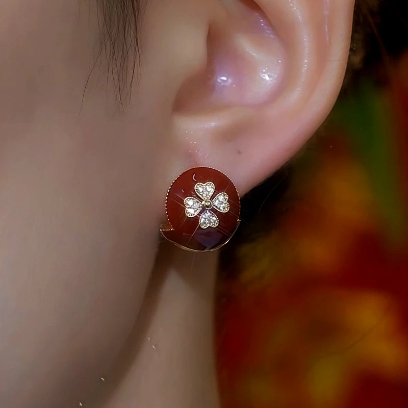 Close-up detail of the sparkling zircons and plating on the Red Flower Studs