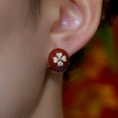 Close-up detail of the sparkling zircons and plating on the Red Flower Studs