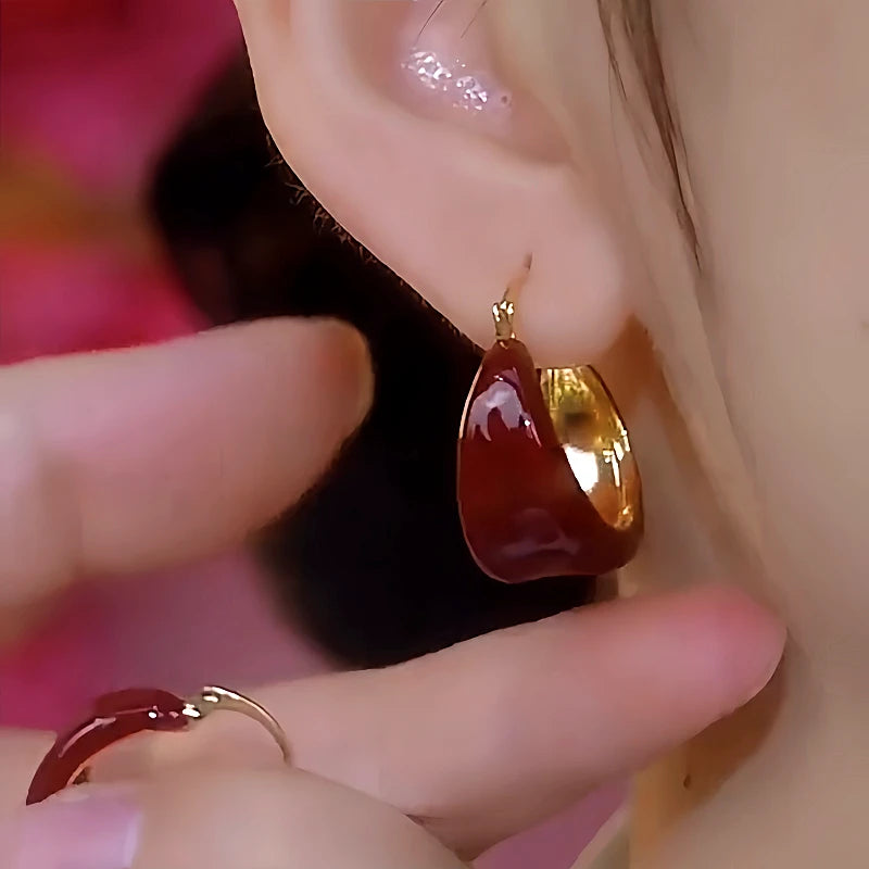 Close-up detail of the sparkling zircons and plating on the Red Drop Earrings