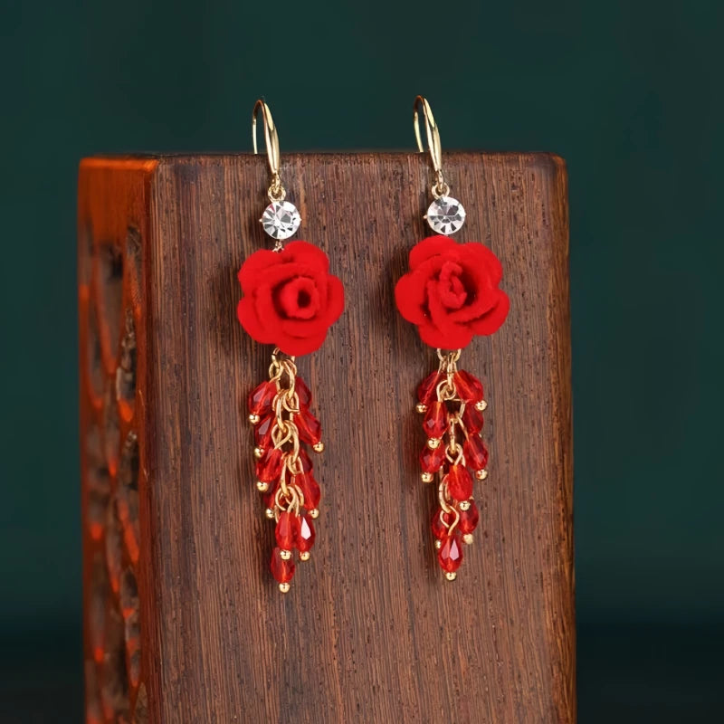 Angled view of the 14K Gold-Plated Red Rose Tassel Ear Hooks