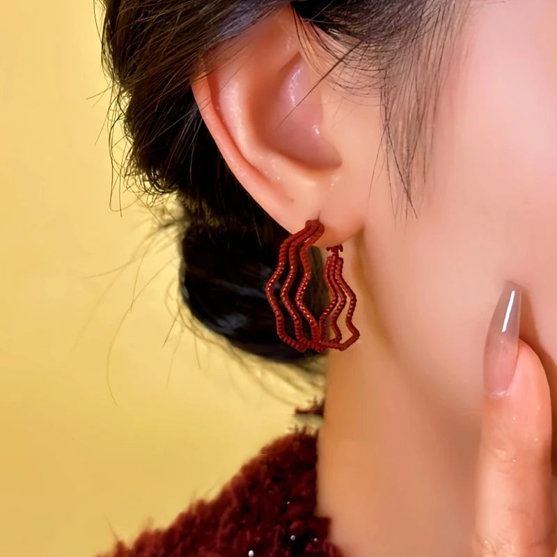 Close-up detail of the sparkling zircons and plating on the Three-Layer Hoops