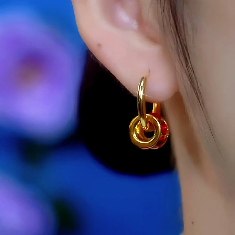 Close-up detail of the sparkling zircons and plating on the Red Zircon Hoops