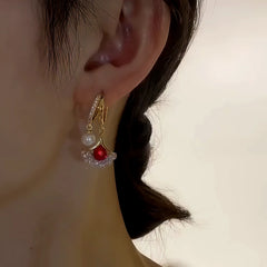 Close-up detail of the sparkling zircons and plating on the Gingko Leaf Earrings