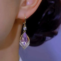 Close-up detail of the sparkling zircons and plating on the Purple Crystal Earrings