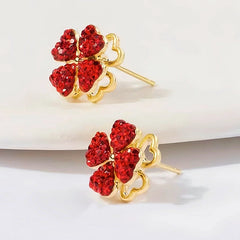 Angled view of the 14K Gold-Plated Rotating Red Flower Earrings