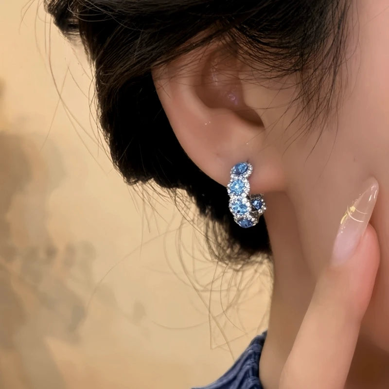 Close-up detail of the sparkling zircons and plating on the Blue Zircon Hoops