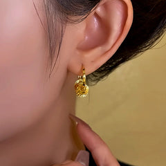 Angled view of the 14K Gold-Plated Sequin Hoop Tassel Earrings