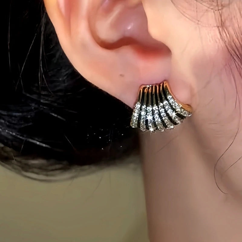 Model showcasing the dangle and style of the 14K Gold-Plated Sexy Diamond Stud Earring