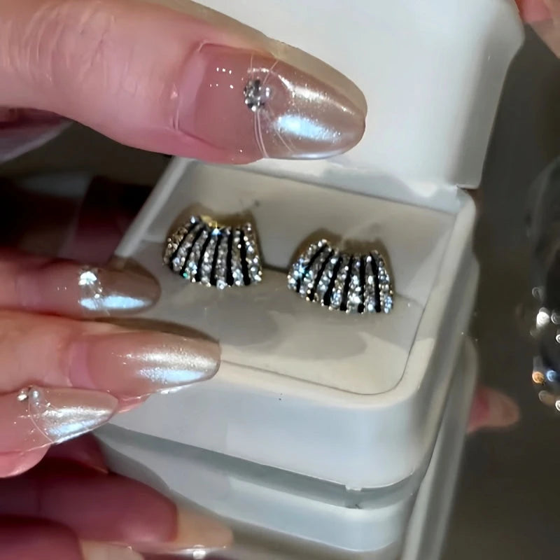 Angled view of the 14K Gold-Plated Sexy Diamond Stud Earring