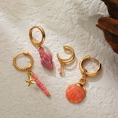 Close-up detail of the sparkling zircons and plating on the Shell Earrings Set
