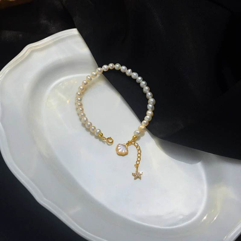 Close-up of the clasp and charm details on the Starfish Pearl Bracelet