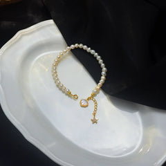 Close-up of the clasp and charm details on the Starfish Pearl Bracelet