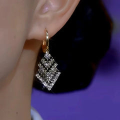 Close-up detail of the sparkling zircons and plating on the Black and White Earrings