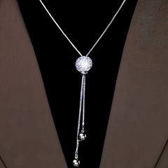 Close-up of the pendant and clasp on the Tassel Sweater Necklace