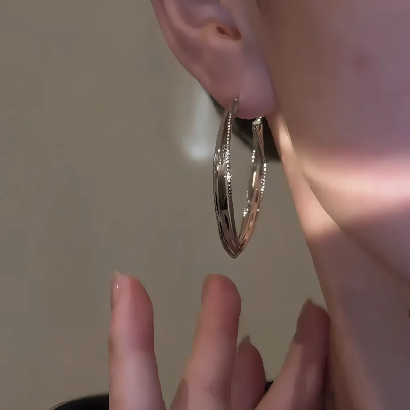 Close-up detail of the sparkling zircons and plating on the Silver Geometric Hoops