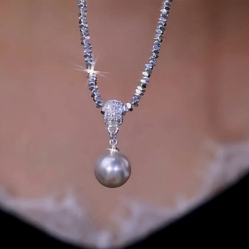 14K Gold-Plated Silver Pearl Earrings worn to showcase its length and pendant detail