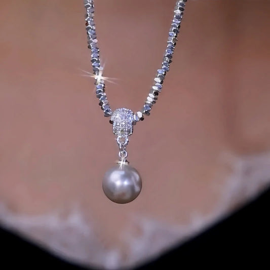 14K Gold-Plated Silver Pearl Earrings worn to showcase its length and pendant detail