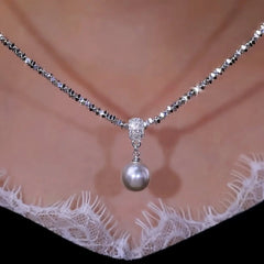 Close-up of the pendant and clasp on the Silver Pearl Necklace