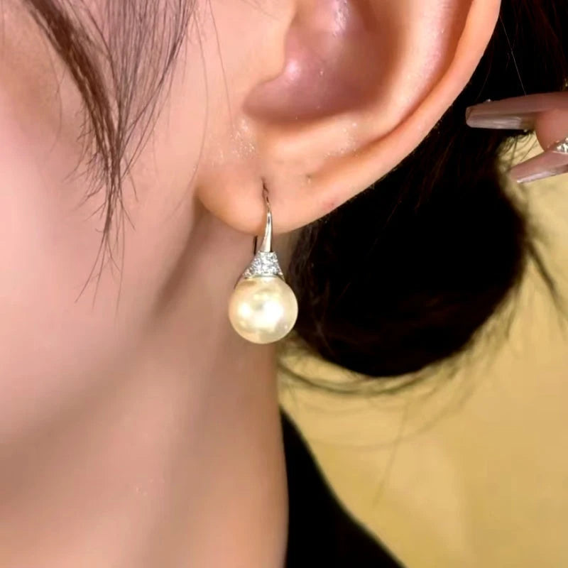 Close-up detail of the sparkling zircons and plating on the Versatile Pearl Earrings