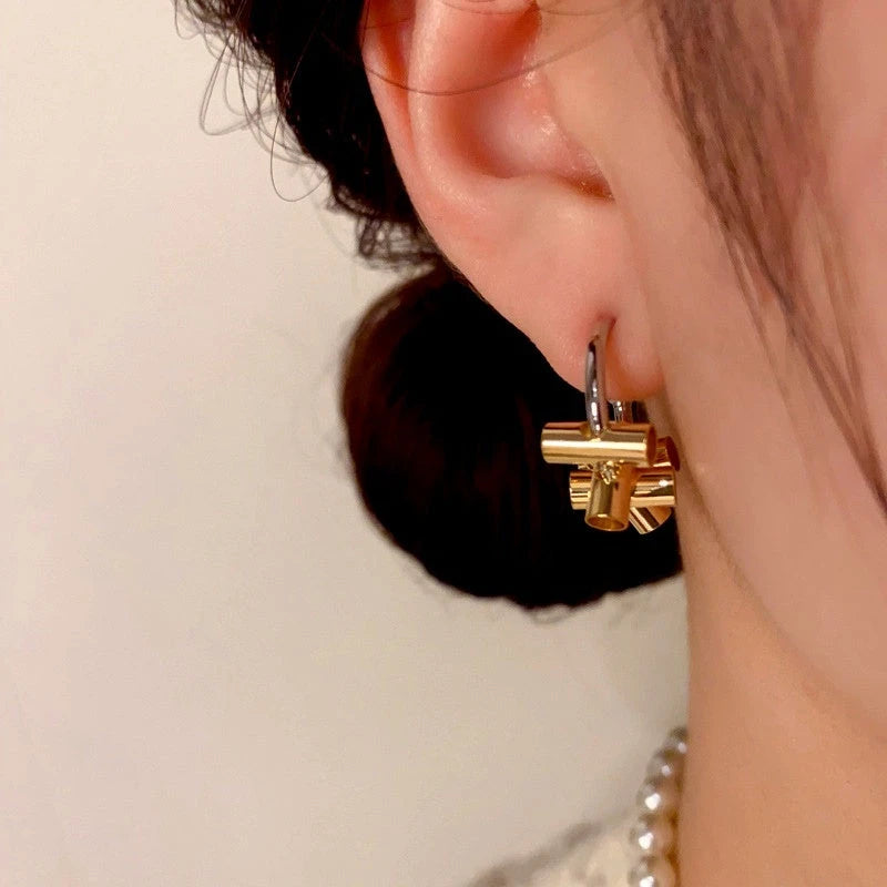Close-up detail of the sparkling zircons and plating on the C-Shaped Hoops