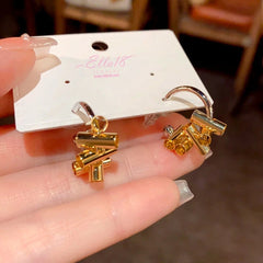 Angled view of the 14K Gold-Plated Simple C-Shaped Earrings