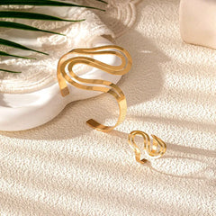 Model wearing the 14K Gold-Plated Simple Snake Bracelets And RIngs Set to highlight its design on the wrist