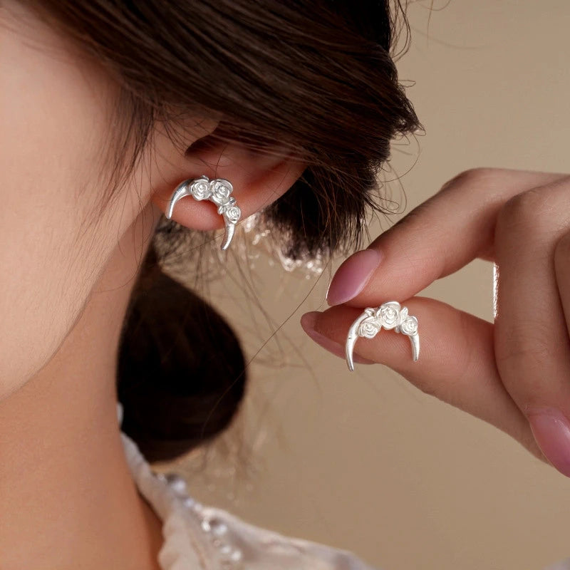 Model showcasing the dangle and style of the 14K Gold-Plated Sleep Tight Flower Moon Stud Earrings