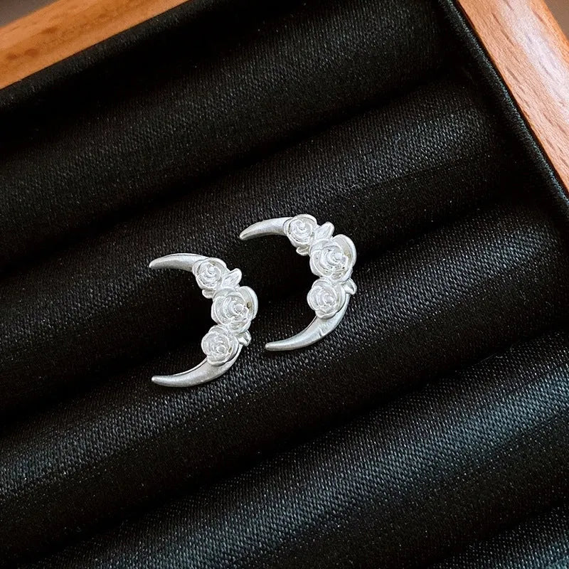 Angled view of the 14K Gold-Plated Sleep Tight Flower Moon Stud Earrings